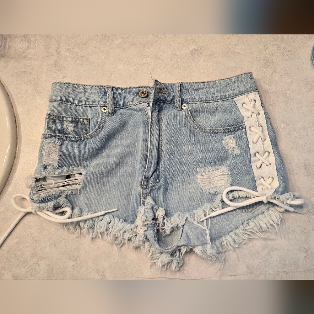 Light Blue Distressed Denim Shorts with Lace-Up Detail On Both Sides